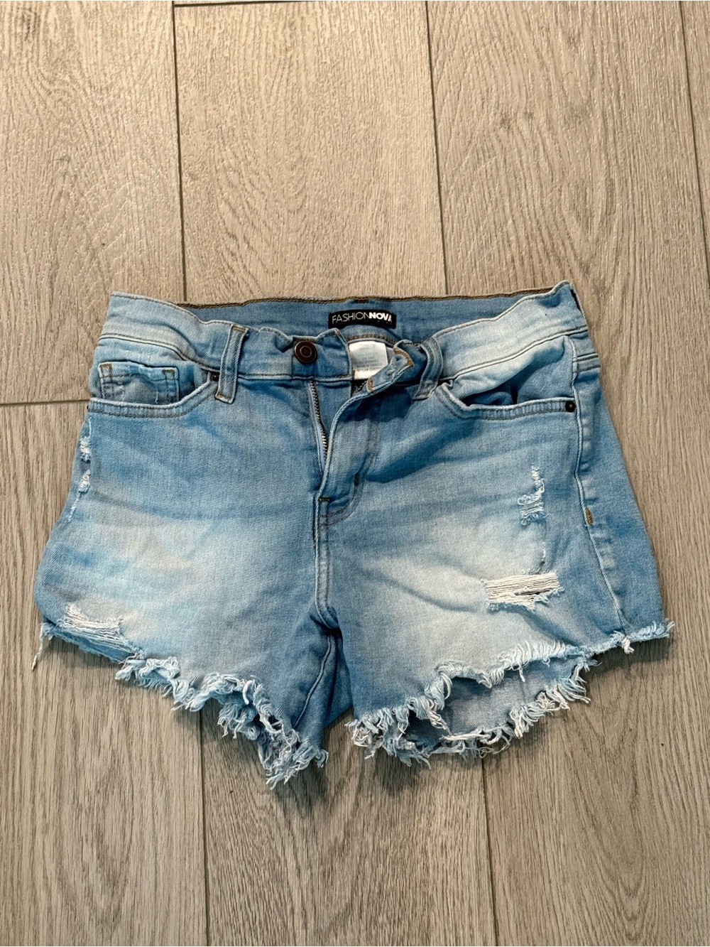 Light wash distressed denim shorts Size 3